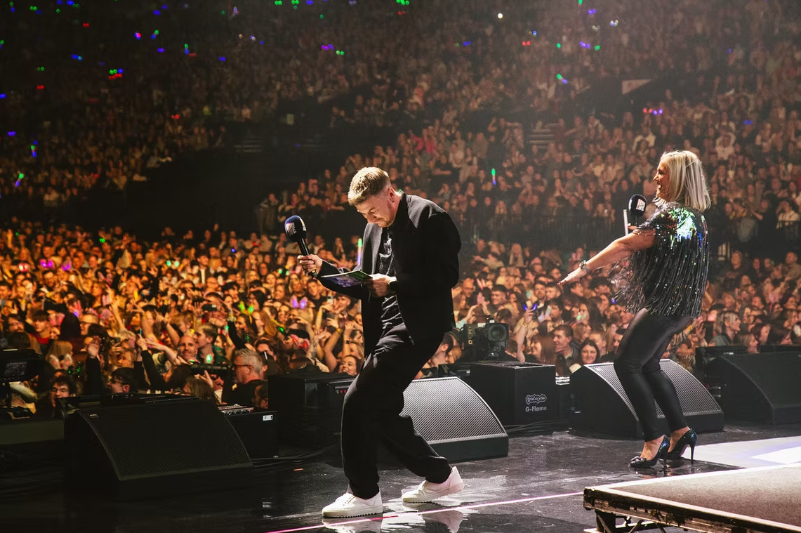 JD on stage with crowd